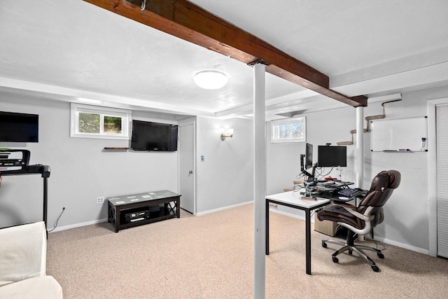 carpeted office space featuring beam ceiling and baseboards