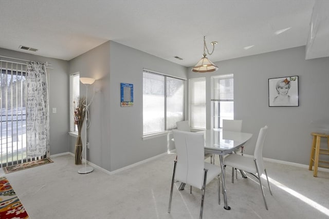 view of carpeted dining area