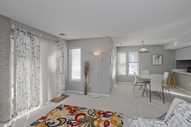 carpeted living room with plenty of natural light