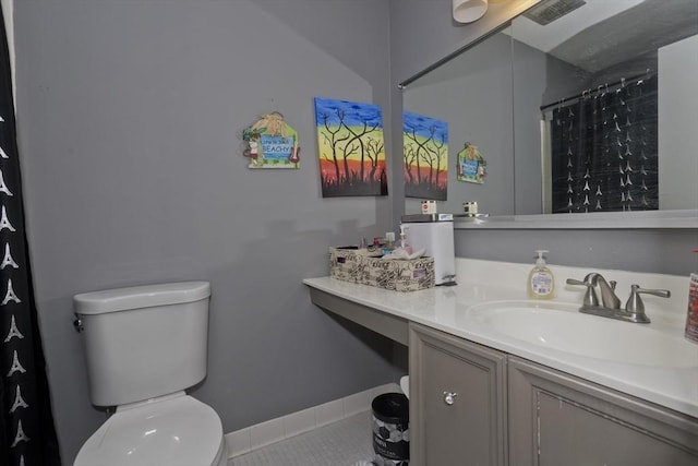 bathroom with vanity, curtained shower, and toilet