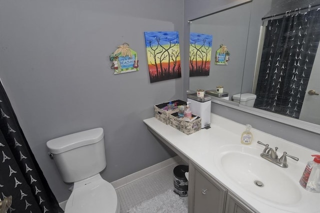 bathroom with a shower with curtain, vanity, toilet, and tile patterned flooring