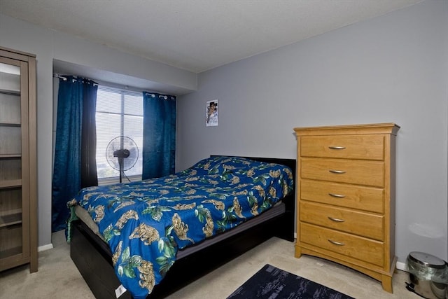 bedroom with light colored carpet