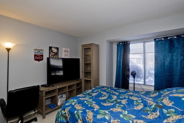 bedroom with carpet flooring and a textured ceiling