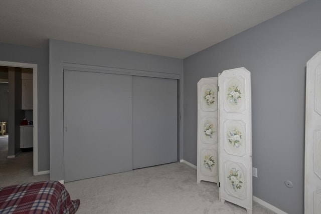 carpeted bedroom with a closet