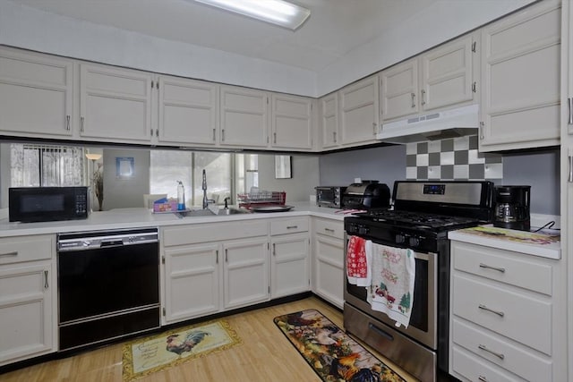 kitchen with white cabinetry, light hardwood / wood-style flooring, and black appliances