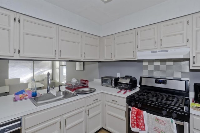 kitchen featuring stainless steel gas range, dishwasher, and white cabinets