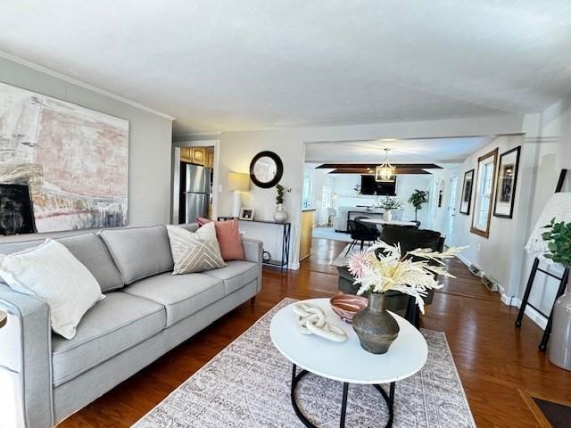 living room with dark hardwood / wood-style flooring