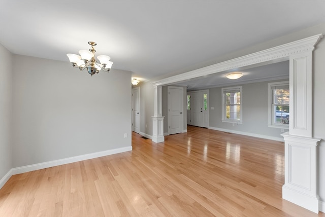 interior space with a chandelier and light wood-type flooring