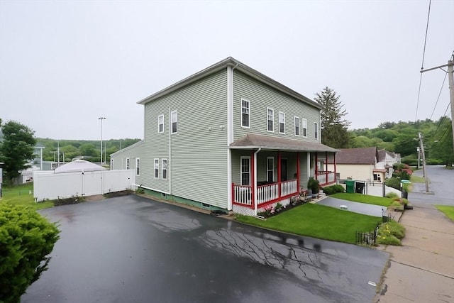 49 Branch St Unit 49, Clinton, MA 01510 - view of front facade featuring a porch and asphalt driveway