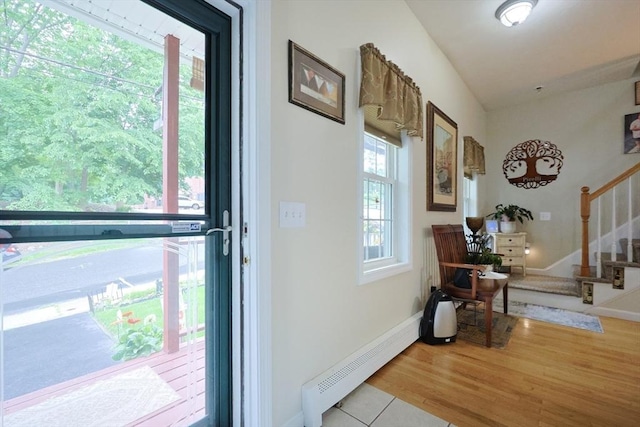 49 Branch St Unit 49, Clinton, MA 01510 - entryway with baseboard heating, stairs, and light wood-style flooring