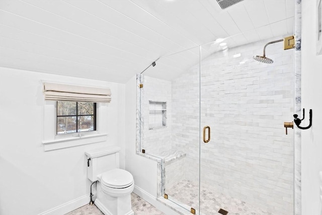 full bathroom with visible vents, toilet, a stall shower, vaulted ceiling, and baseboards