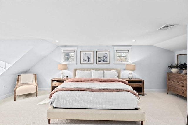 bedroom featuring lofted ceiling, visible vents, light carpet, and baseboards