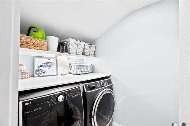 laundry room with laundry area and washing machine and clothes dryer