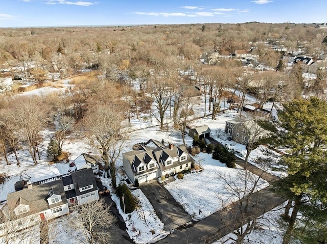 snowy aerial view with a residential view