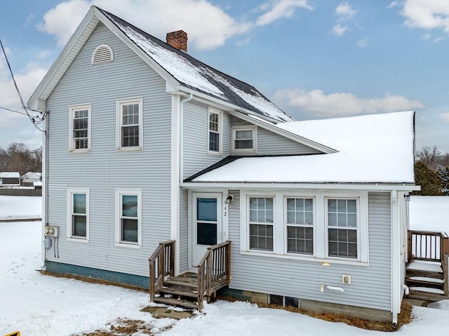 view of front of home with a chimney