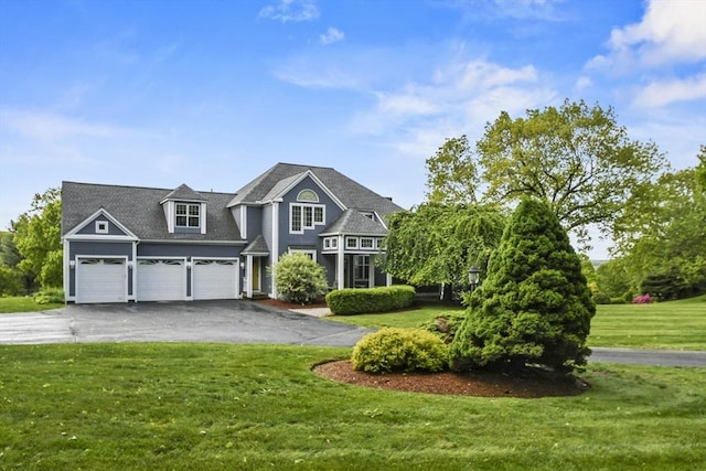 52 S Nelson Rd, Sterling, MA 01564 - view of front of home featuring driveway, a front lawn, and a garage
