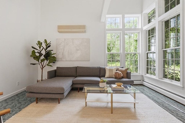 52 S Nelson Rd, Sterling, MA 01564 - living room with a wall mounted air conditioner and a baseboard heating unit