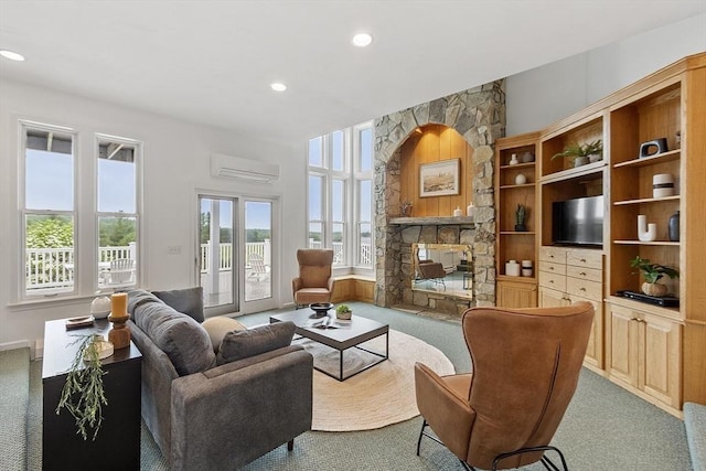 52 S Nelson Rd, Sterling, MA 01564 - carpeted living area featuring a wall unit AC, a fireplace, and recessed lighting