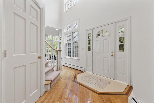 52 S Nelson Rd, Sterling, MA 01564 - foyer entrance featuring a baseboard radiator, stairway, and light wood-type flooring