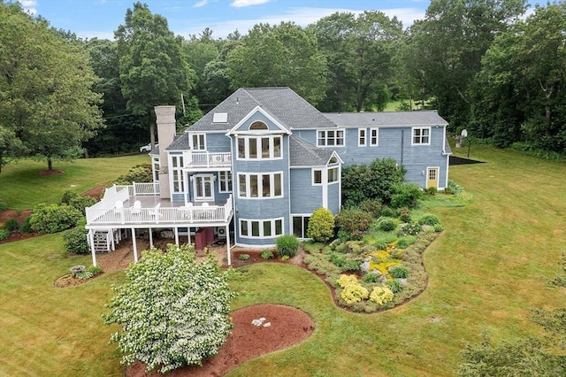52 S Nelson Rd, Sterling, MA 01564 - rear view of property featuring a wooden deck, a lawn, a chimney, and stairway