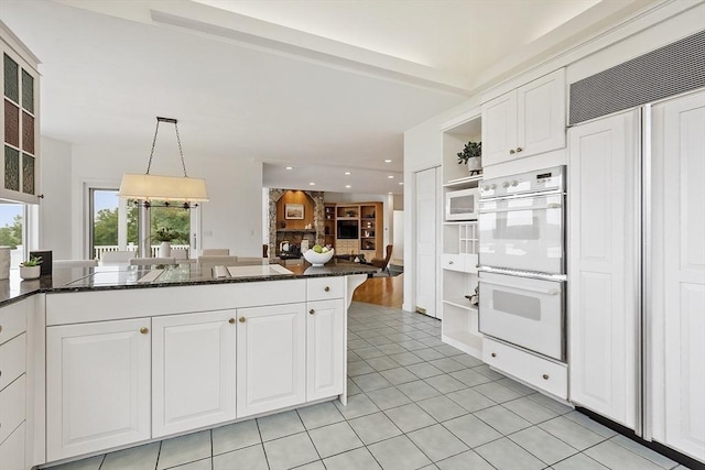 52 S Nelson Rd, Sterling, MA 01564 - kitchen featuring white appliances, white cabinetry, open shelves, dark stone counters, and light tile patterned floors
