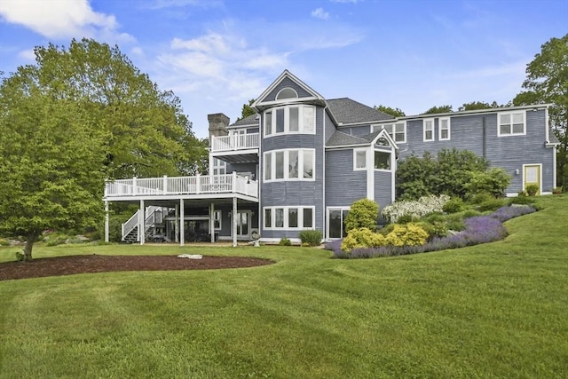 52 S Nelson Rd, Sterling, MA 01564 - rear view of property with stairs, a lawn, a deck, a chimney, and a balcony