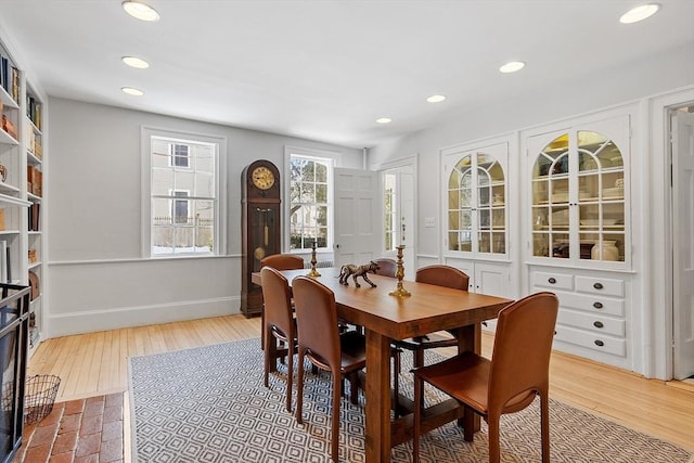 dining area featuring recessed lighting, wood finished floors, and baseboards