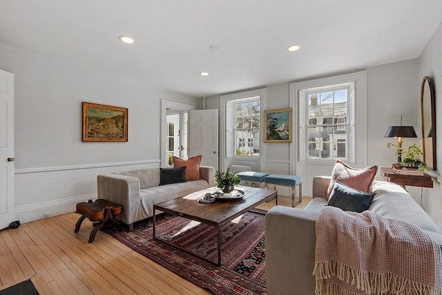 living room featuring hardwood / wood-style floors and recessed lighting