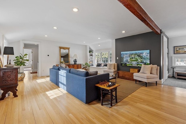 living room with vaulted ceiling with beams, light wood finished floors, baseboards, and recessed lighting