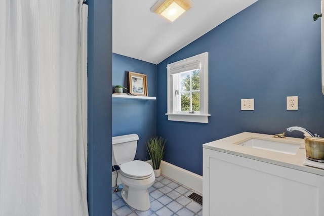 full bathroom featuring lofted ceiling, tile patterned flooring, toilet, vanity, and baseboards