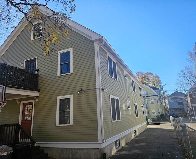 back of property with a balcony