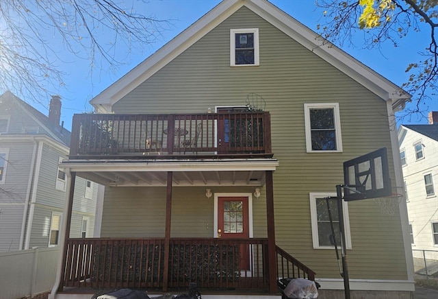 rear view of house with a balcony