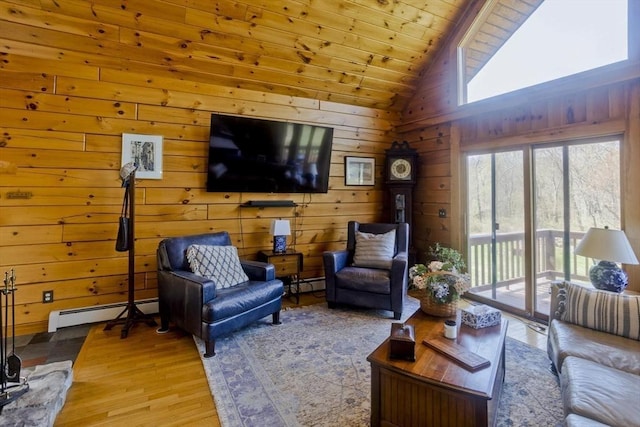 living room with wooden ceiling, a baseboard radiator, a baseboard heating unit, lofted ceiling, and light wood-style floors