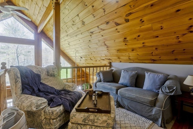 sitting room with lofted ceiling with beams, wood ceiling, and ceiling fan