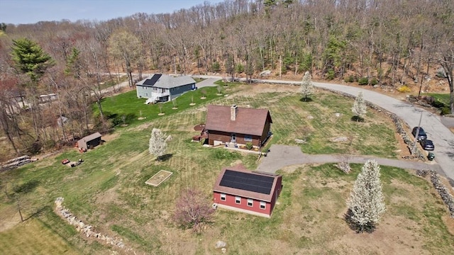 drone / aerial view with a view of trees