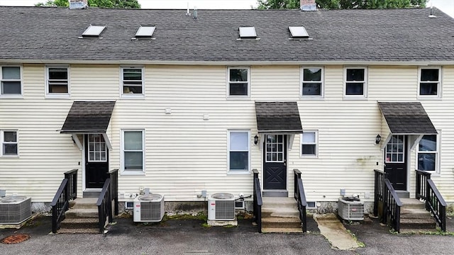 6 A St Unit 6, Northbridge, MA 01588 - back of house with entry steps, a chimney, and roof with shingles
