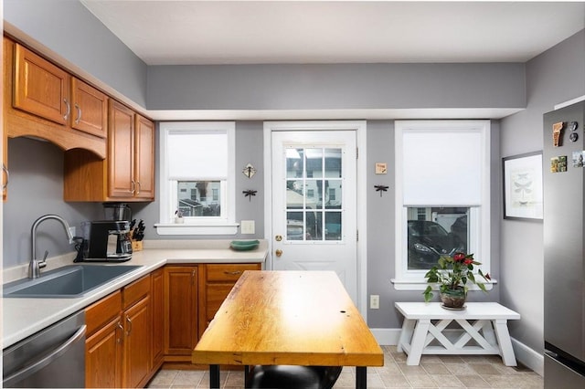 6 A St Unit 6, Northbridge, MA 01588 - kitchen with dishwasher, light countertops, and brown cabinetry