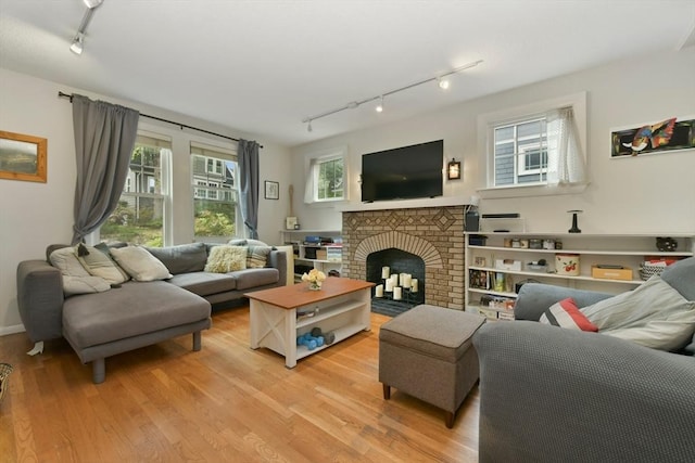 11 Goodway Rd Unit 1, Boston, MA 02130 - living room featuring track lighting, light wood-type flooring, and a fireplace