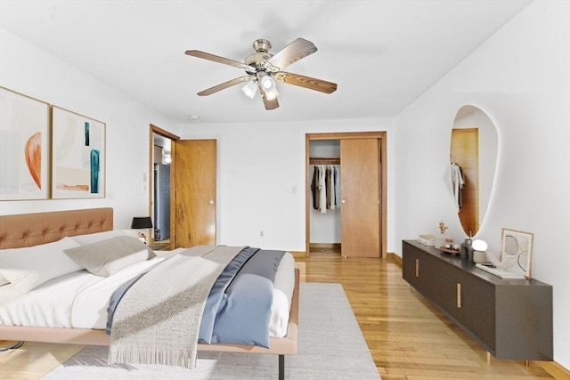 bedroom with ceiling fan and light wood-type flooring