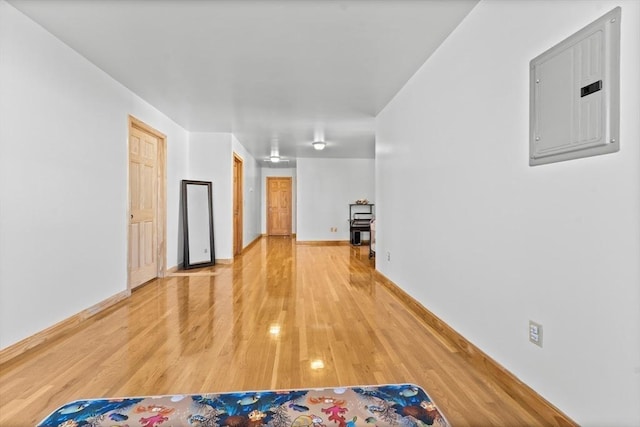 interior space featuring electric panel and hardwood / wood-style floors