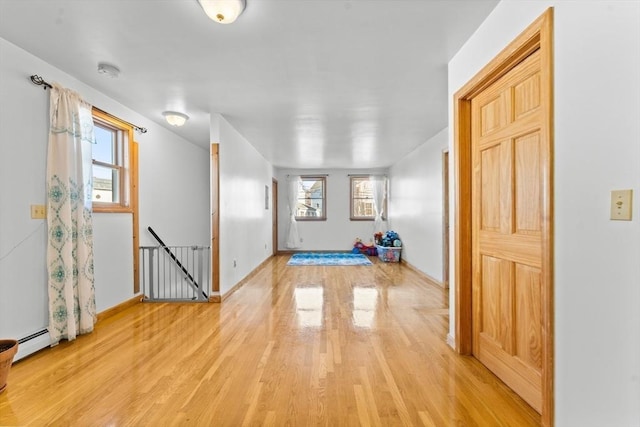 interior space featuring light hardwood / wood-style floors and baseboard heating