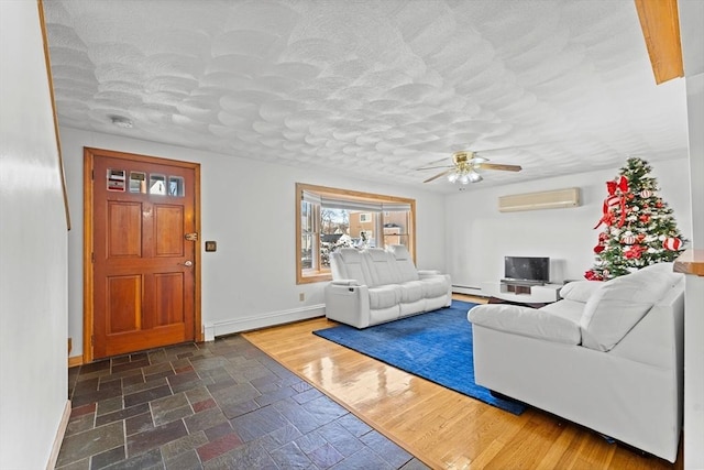 unfurnished living room featuring baseboard heating, ceiling fan, and a wall mounted AC