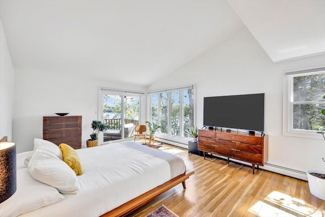 bedroom with access to outside, vaulted ceiling, and light wood-type flooring