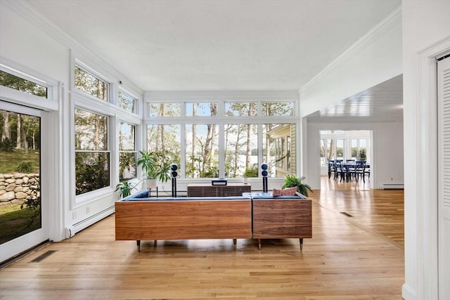 sunroom featuring a baseboard radiator