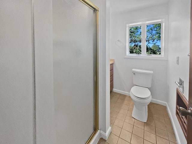 full bath featuring tile patterned floors, baseboards, vanity, and a stall shower