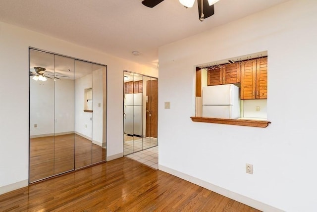 200 Burkhall Unit 103, Weymouth, MA 02190 - spare room with ceiling fan and wood finished floors