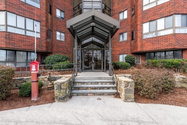 200 Burkhall Unit 103, Weymouth, MA 02190 - doorway to property featuring french doors and brick siding