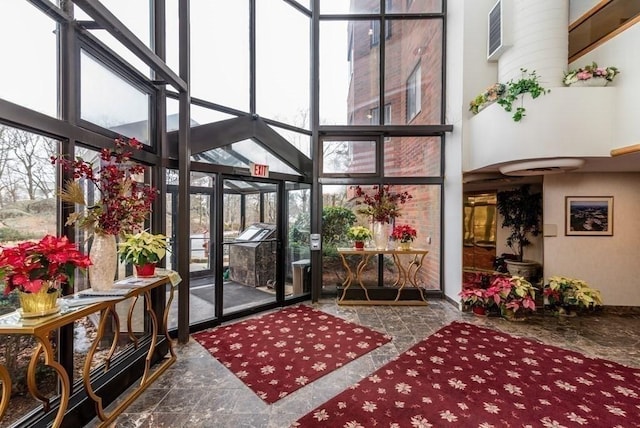 200 Burkhall Unit 103, Weymouth, MA 02190 - building lobby featuring a high ceiling and floor to ceiling windows
