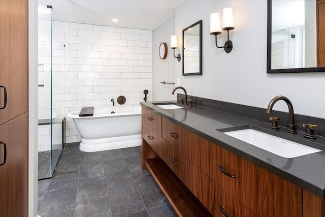 bathroom with tile walls, a bath, and vanity