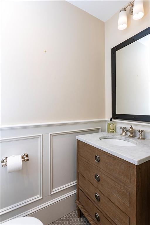 bathroom with vanity and toilet